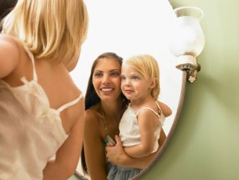 mum and daughter in mirror